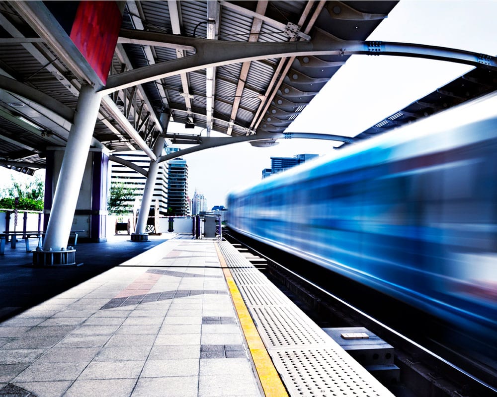 image of a train platform and fast moving train - Primary investment